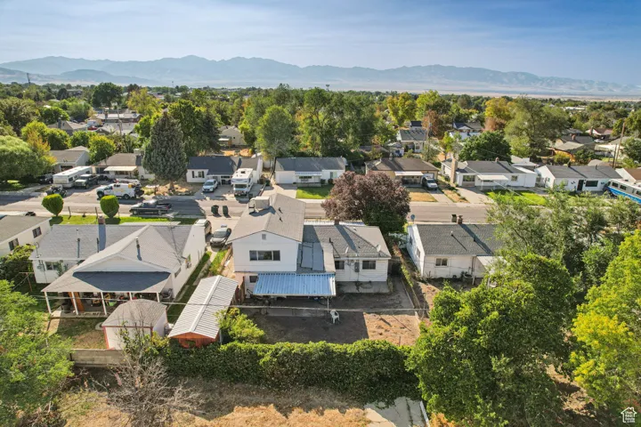 Aerial view of residential area featuring a mountainous background