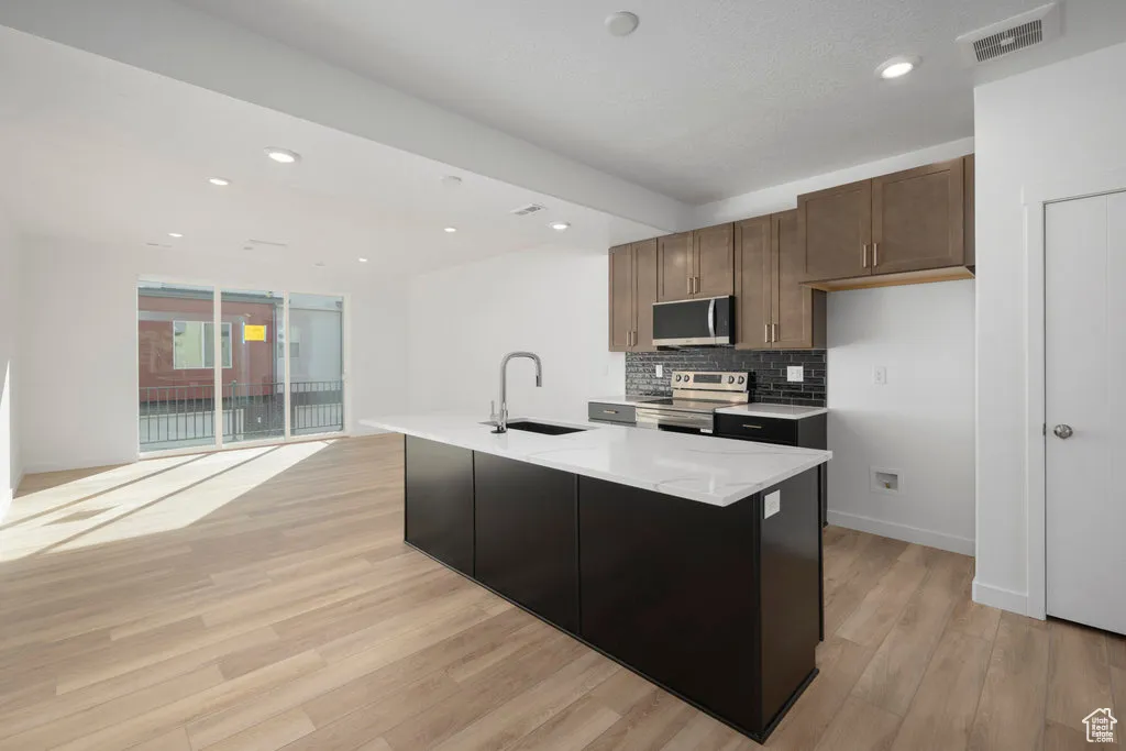 A total 'wow' kitchen-quartz countertops, stainless appliances, and a big island for charcuterie or homework.