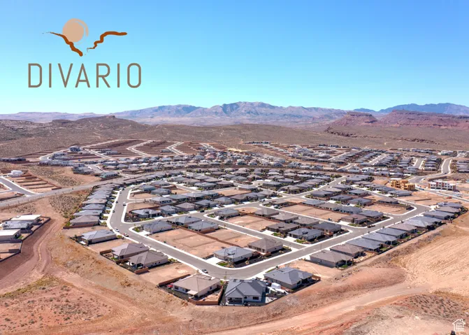 Aerial perspective of suburban area featuring a mountain backdrop