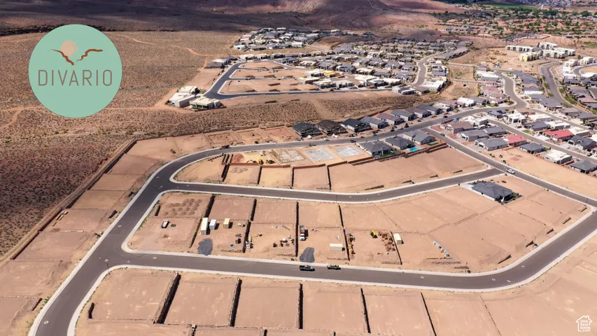 Aerial view of property and surrounding area with nearby suburban area