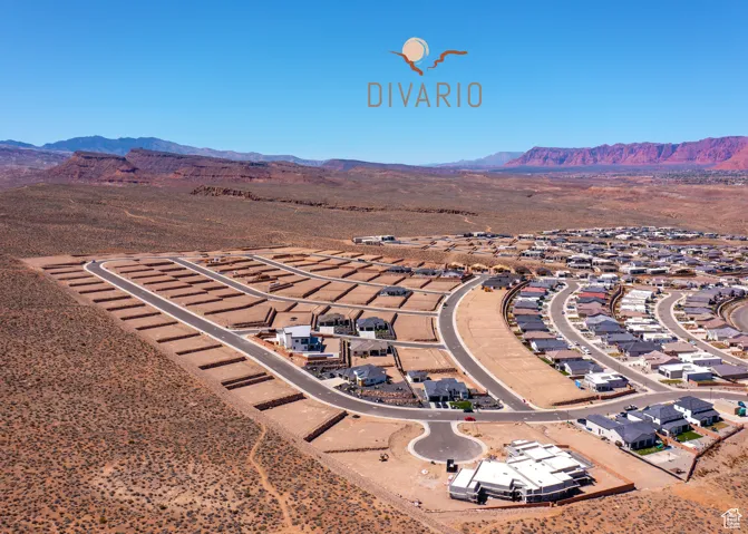 Drone / aerial view of a mountain backdrop and a desert landscape
