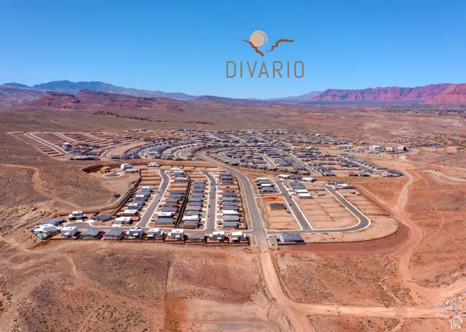 Aerial perspective of suburban area with a mountainous background and a desert landscape