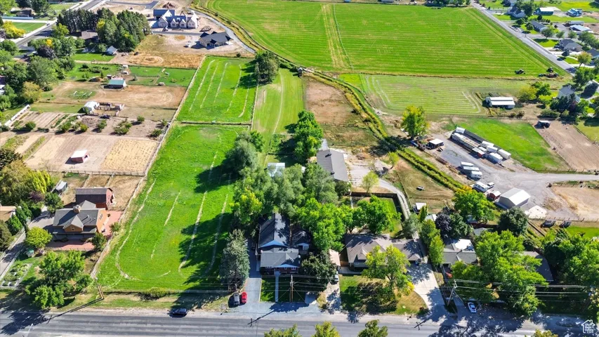 Aerial view of property and surrounding area with rural landscape and extensive farmland