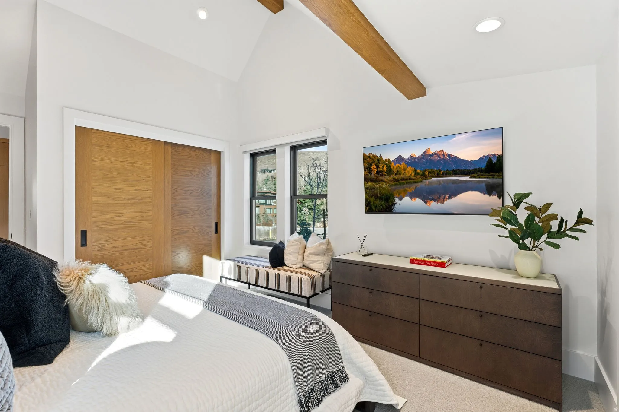 Carpeted bedroom featuring a closet, high vaulted ceiling, recessed lighting, and beamed ceiling