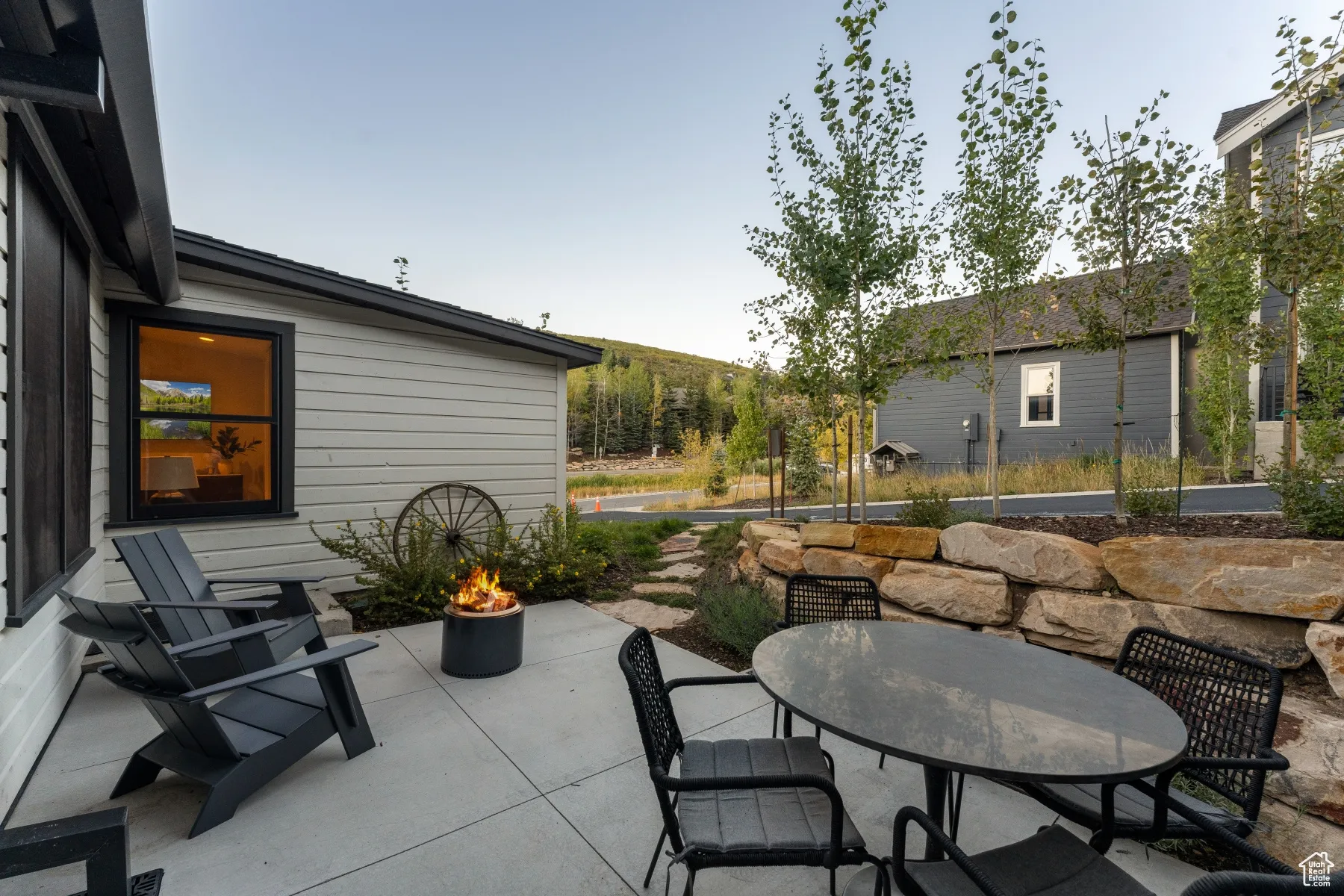 View of patio / terrace featuring outdoor dining area and a fire pit