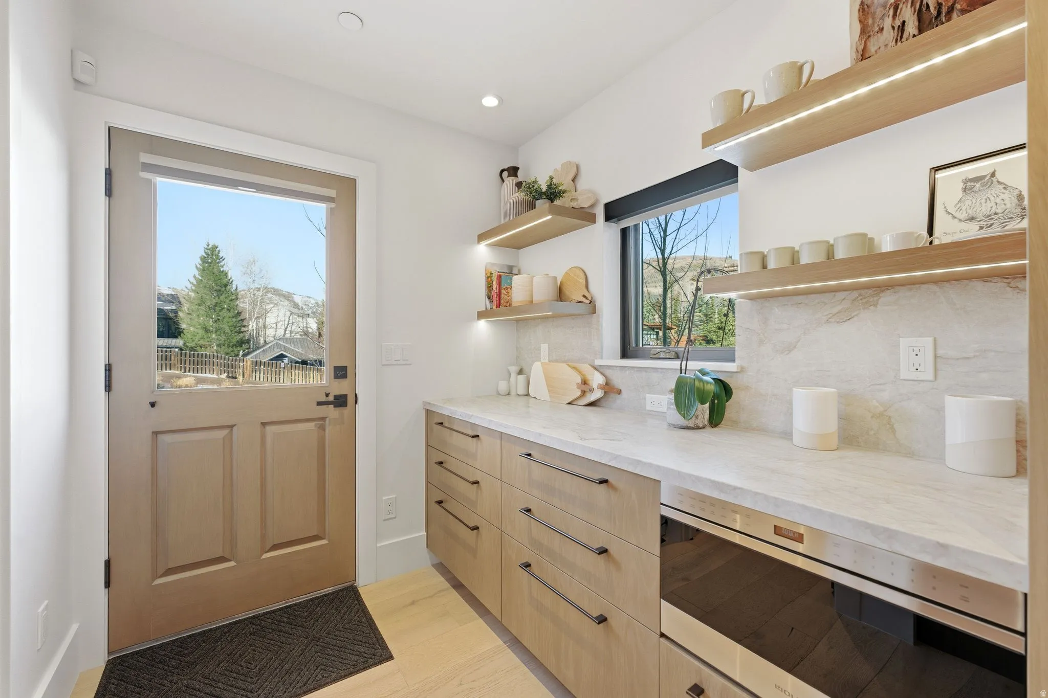 Entryway featuring wood finished floors and recessed lighting