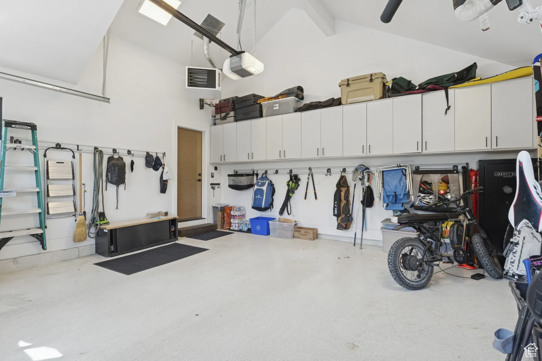 Garage featuring a garage door opener