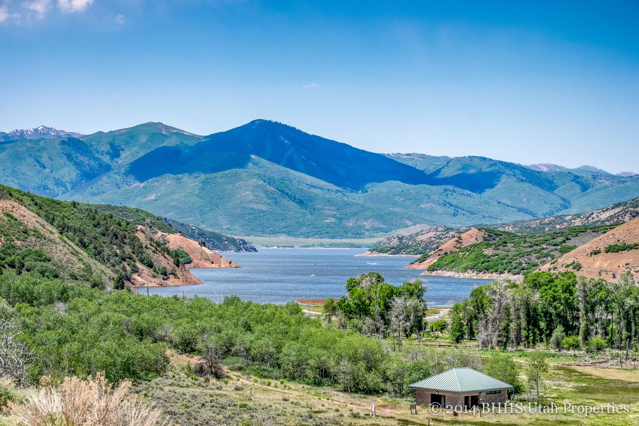 View of mountain backdrop with a nearby body of water