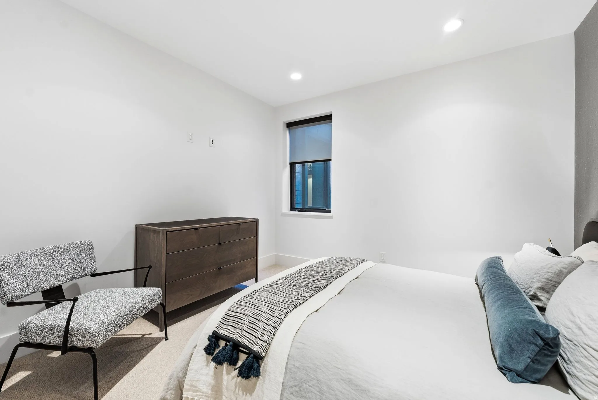 Carpeted bedroom with baseboards and recessed lighting