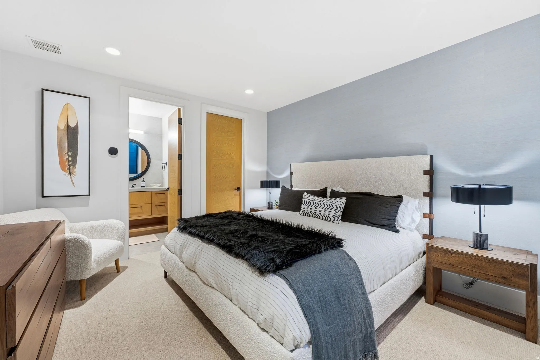 Bedroom with recessed lighting, connected bathroom, and carpet floors