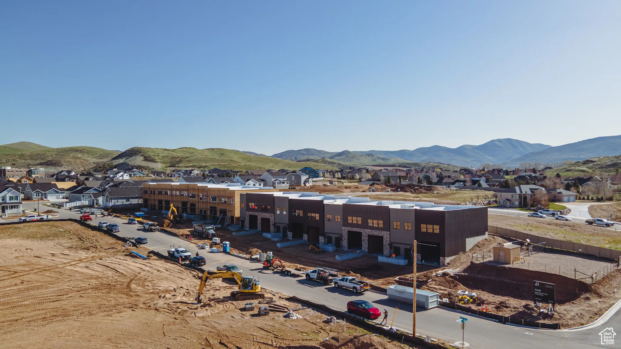 Aerial perspective of suburban area featuring a mountainous background