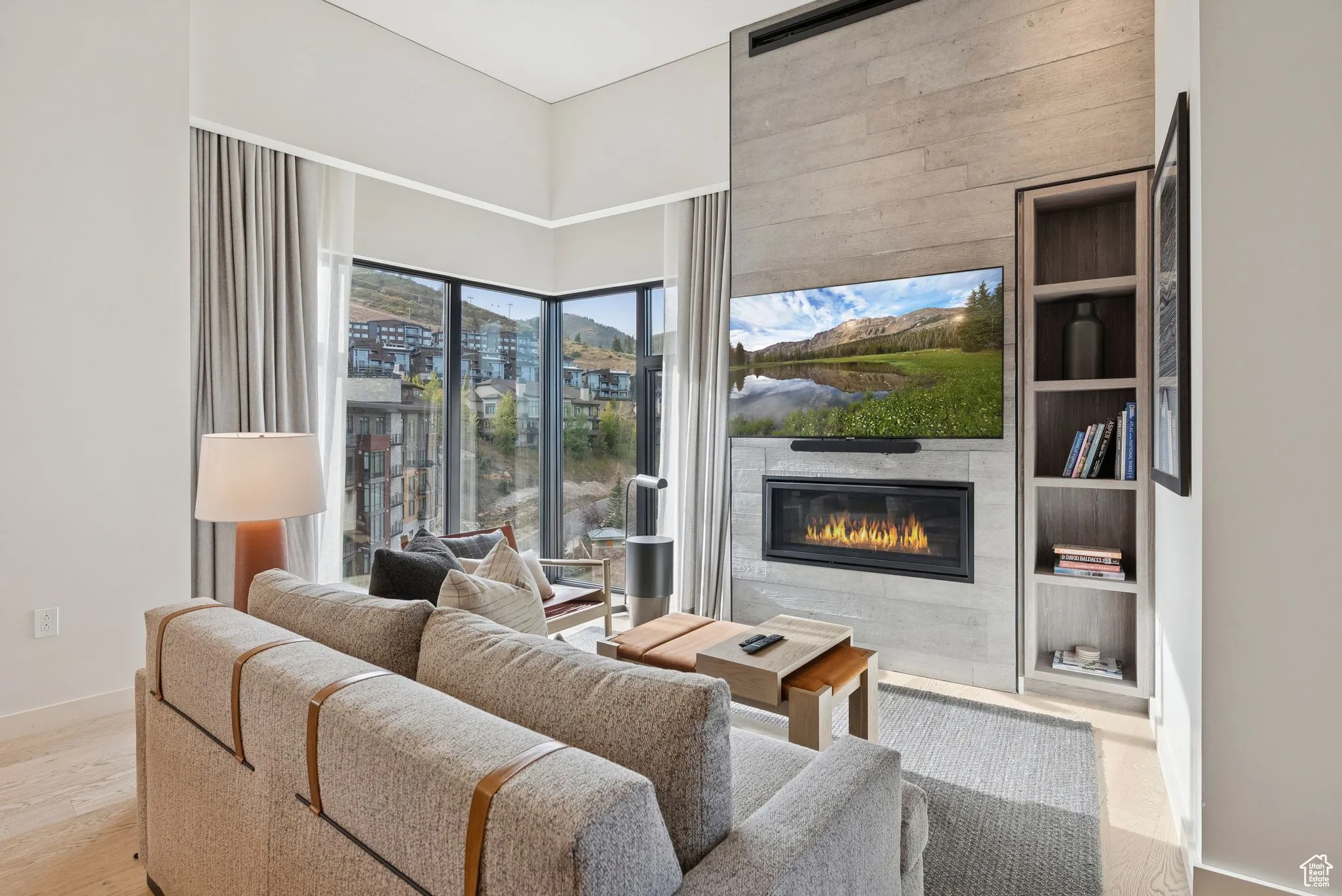 Living room featuring light wood finished floors and a fireplace