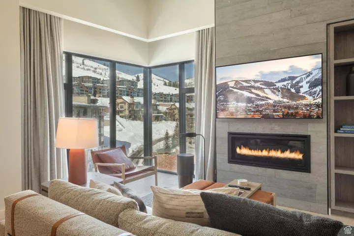 Living area with a glass covered fireplace