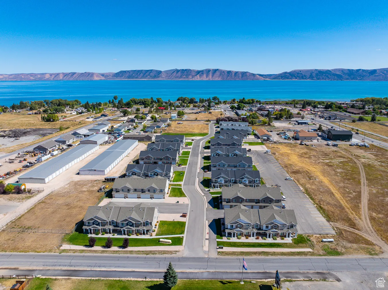 Aerial view of residential area featuring a water and mountain view