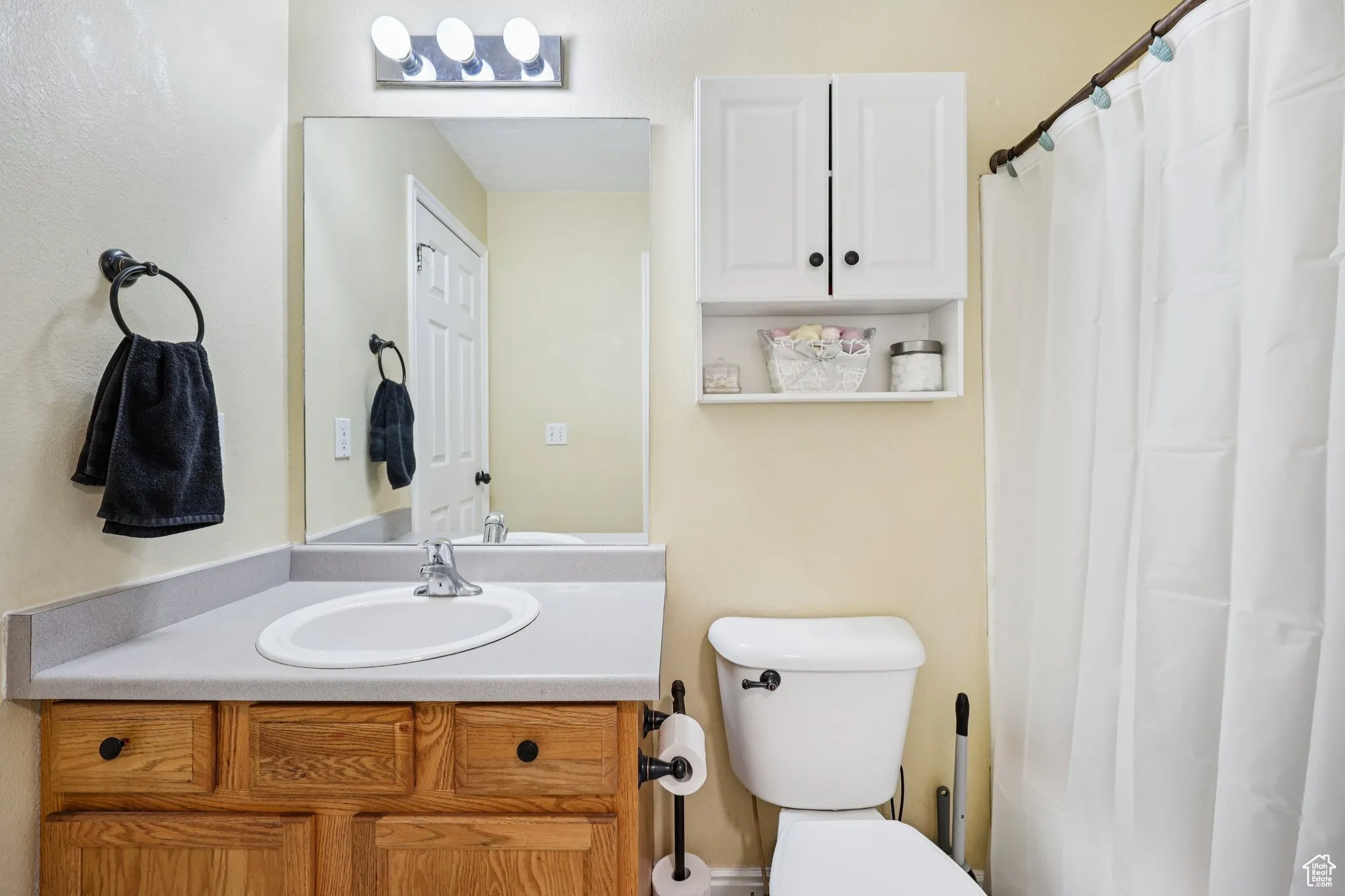 Bathroom with vanity and a shower with curtain