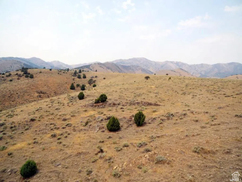 View of mountain background featuring rural landscape