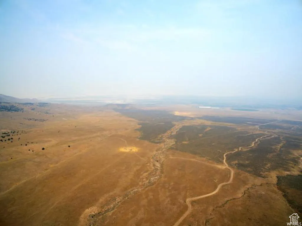 Aerial view of property and surrounding area with rural landscape