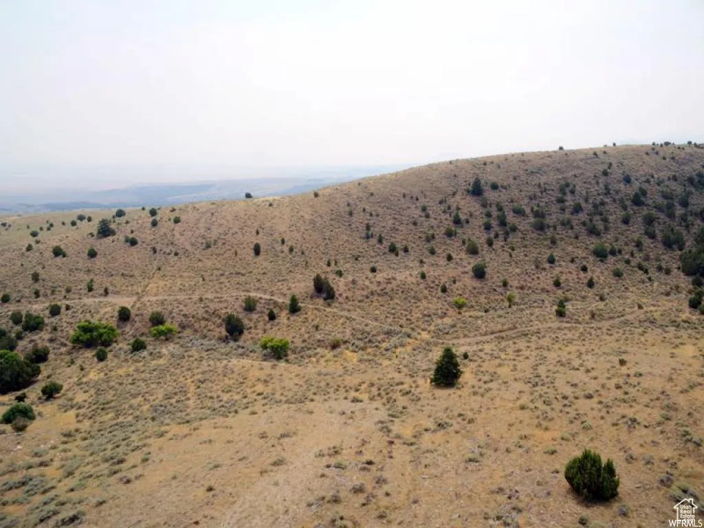 View of mountain backdrop featuring rural landscape and a desert landscape