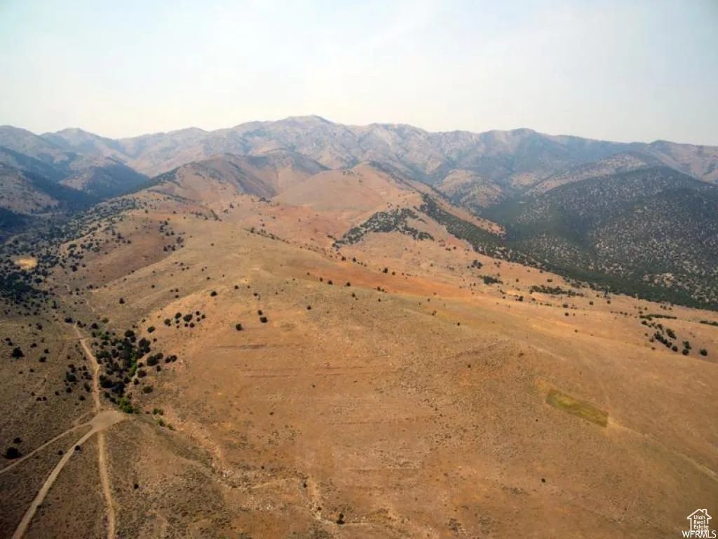 View of mountain backdrop with rural landscape