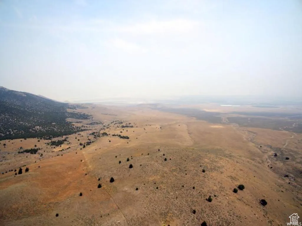 Aerial overview of property's location featuring rural landscape and a mountain backdrop