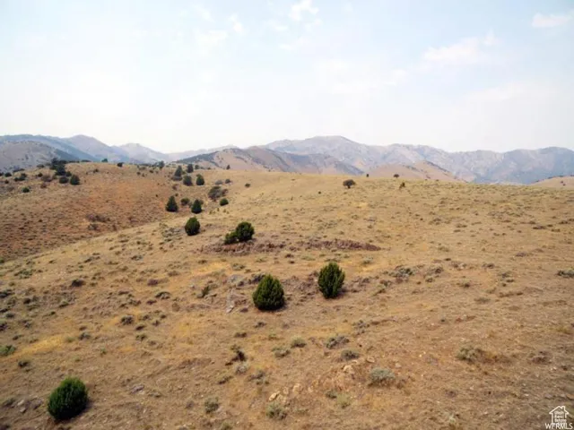 View of mountain background featuring rural landscape