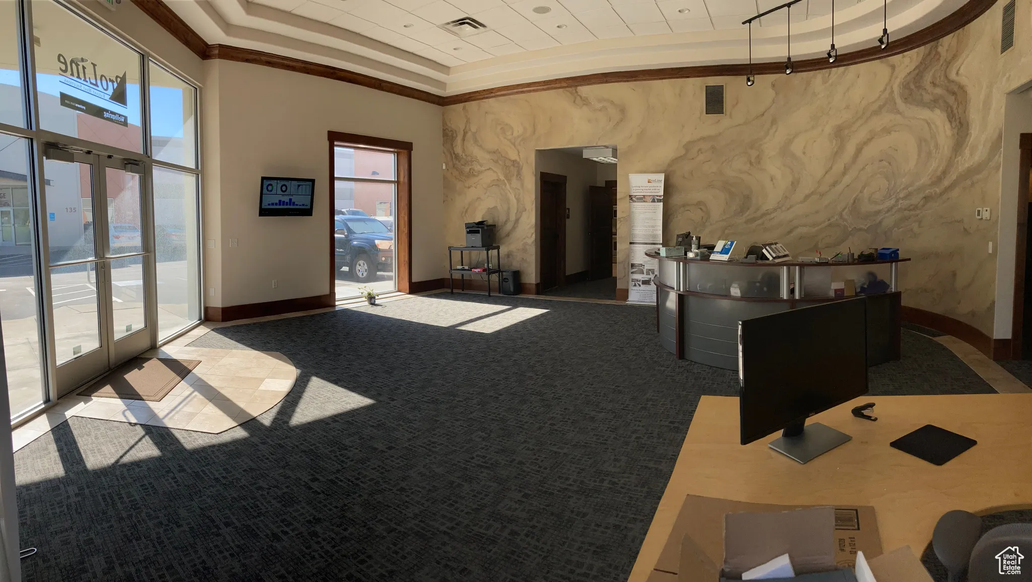 Reception area featuring a towering ceiling