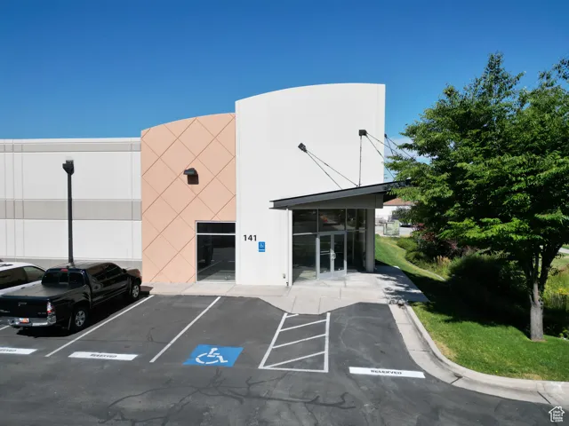 View of property with uncovered parking