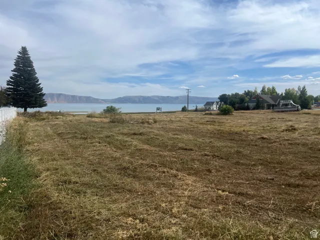 View of yard featuring a water and mountain view