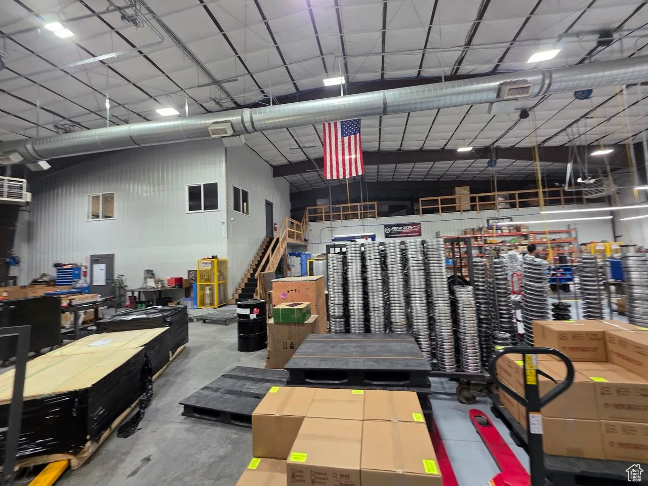 Garage featuring metal wall and a workshop area