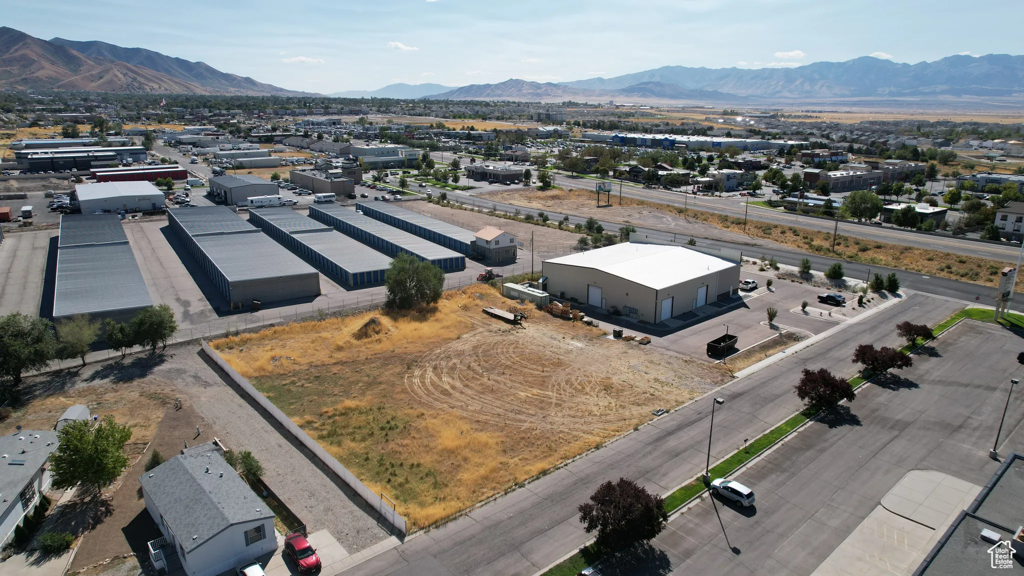 Drone / aerial view of an industrial area and a mountainous background