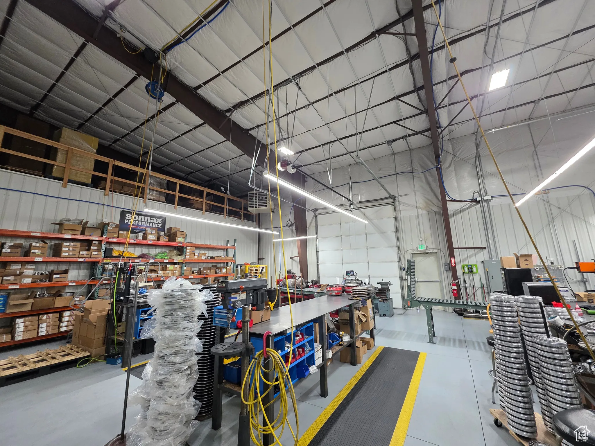 Garage with metal wall and a workshop area