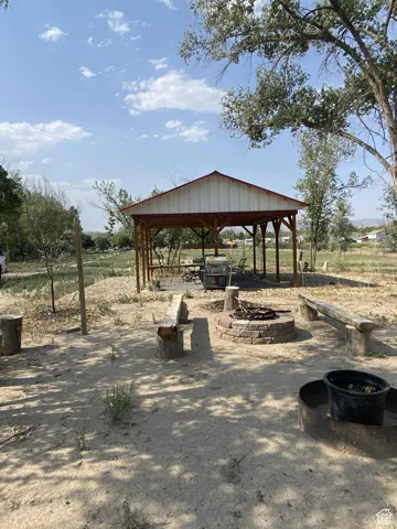 View of community featuring a patio area and a fire pit
