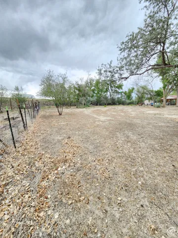 View of yard with a rural view