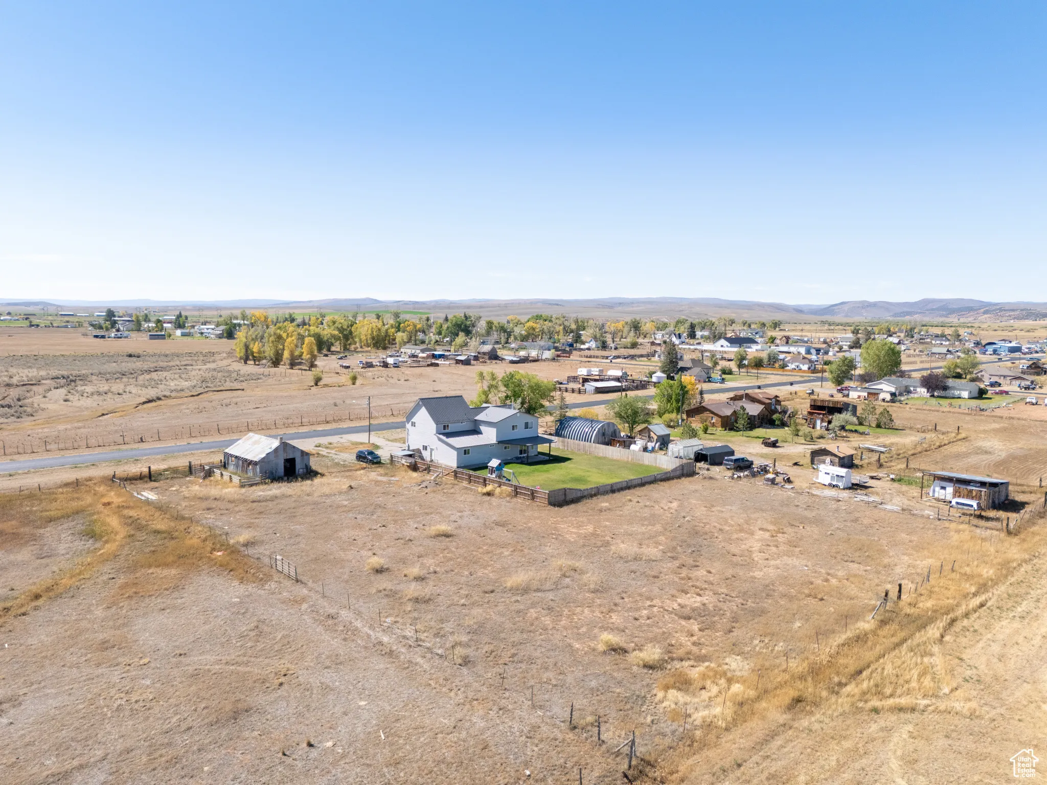 Aerial view of sparsely populated area with a mountain backdrop