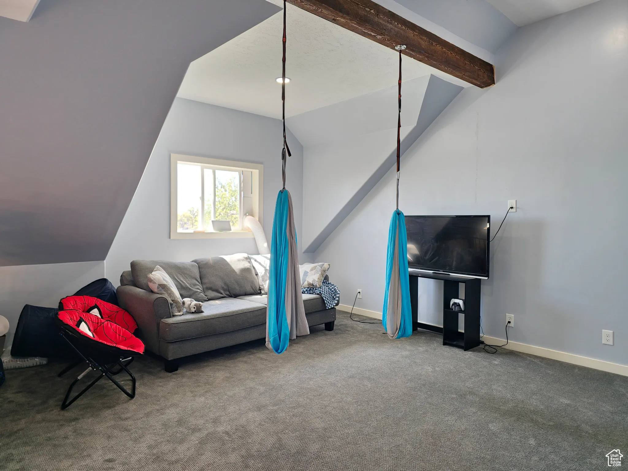 Living area with carpet and baseboards