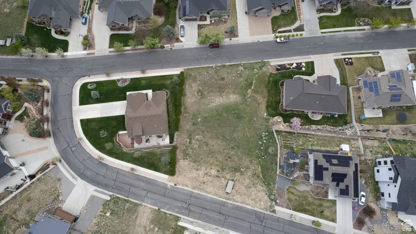 Aerial overview of property's location featuring nearby suburban area.  Notice there are two accesses  into this lot.