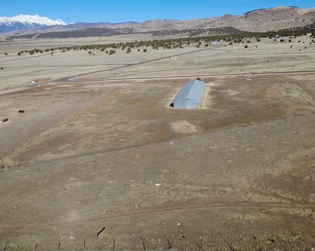 Aerial view of sparsely populated area with a mountainous background