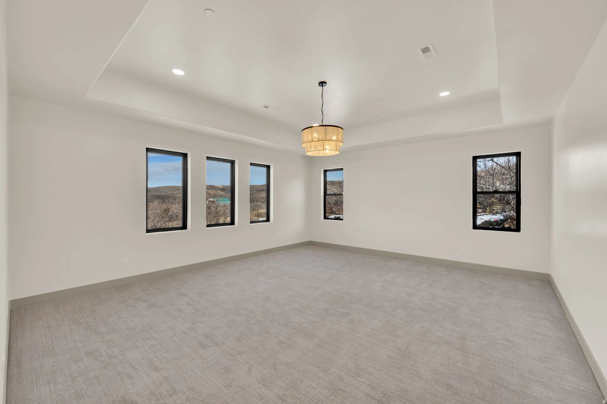 Master bedroom with views of nature from every window.