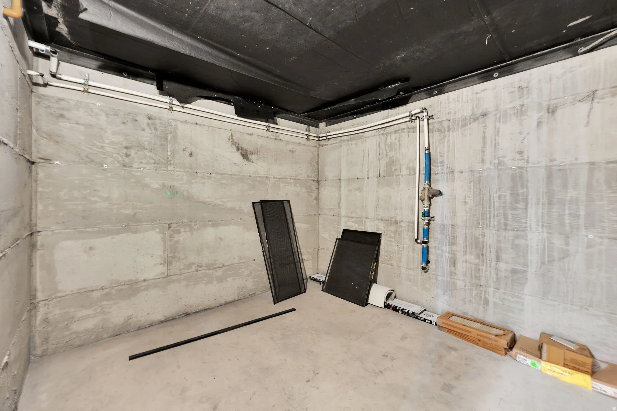 Large basement storage room under front porch.