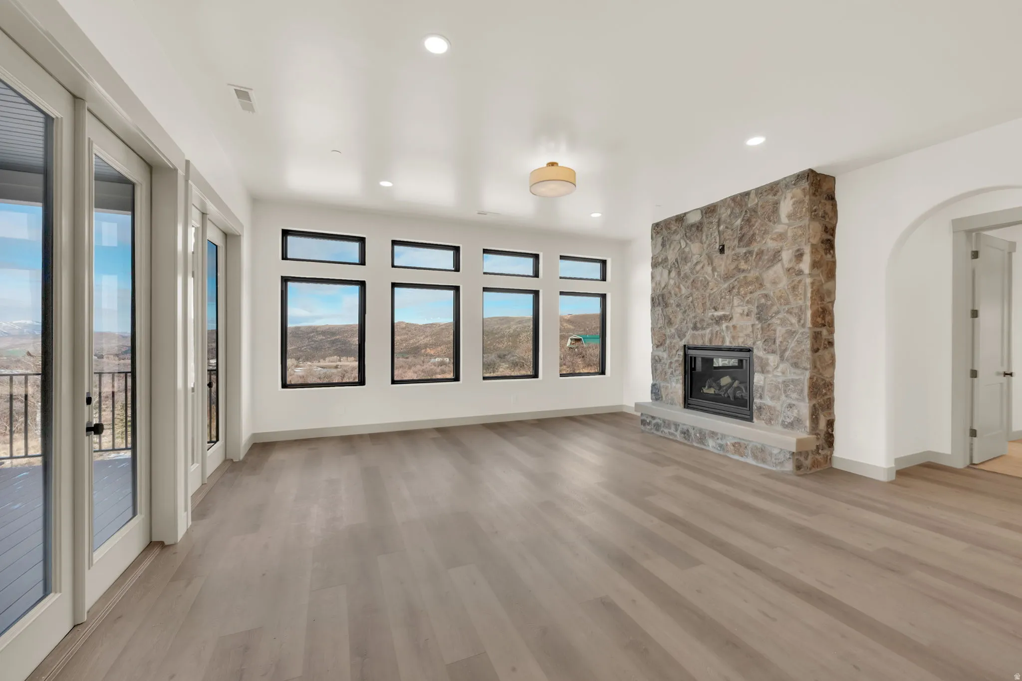 Great room fireplace with natural stone.