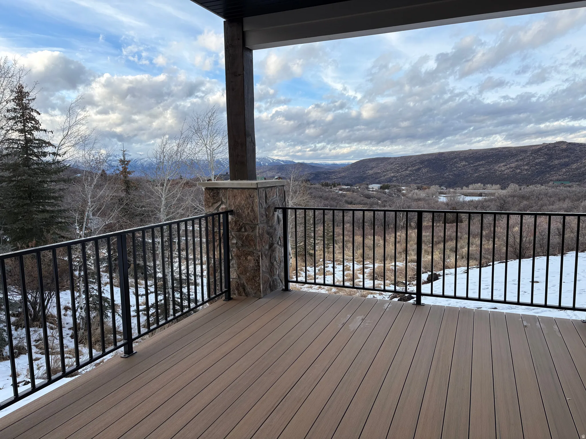 Covered deck off great room with endless views.