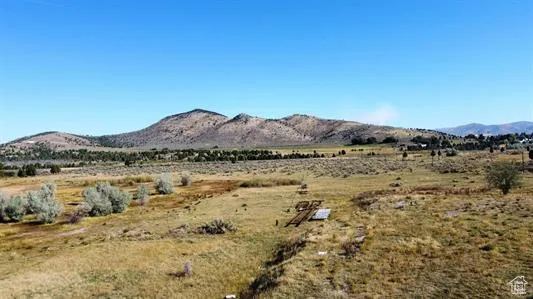 View of mountain background featuring rural landscape