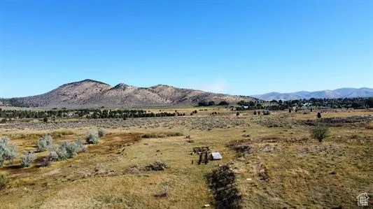 View of mountain backdrop featuring rural landscape