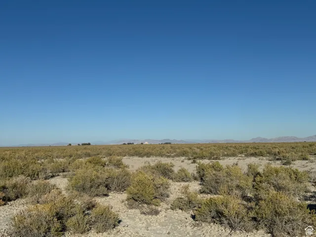 View of undeveloped land with a mountainous background