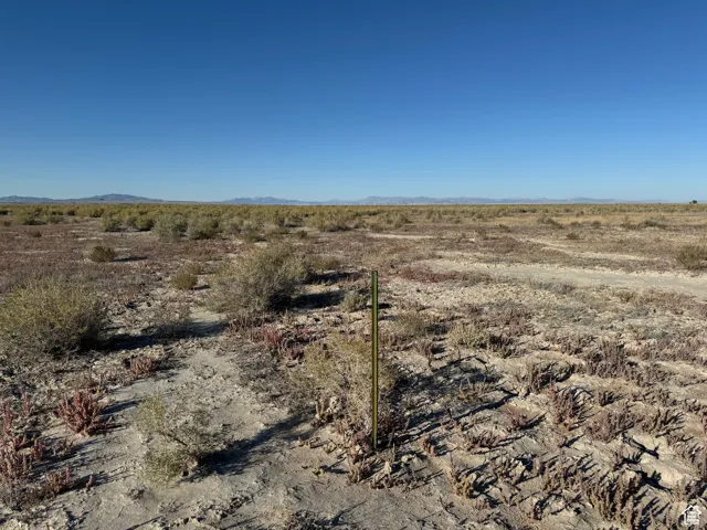 View of undeveloped land with rural landscape and mountains