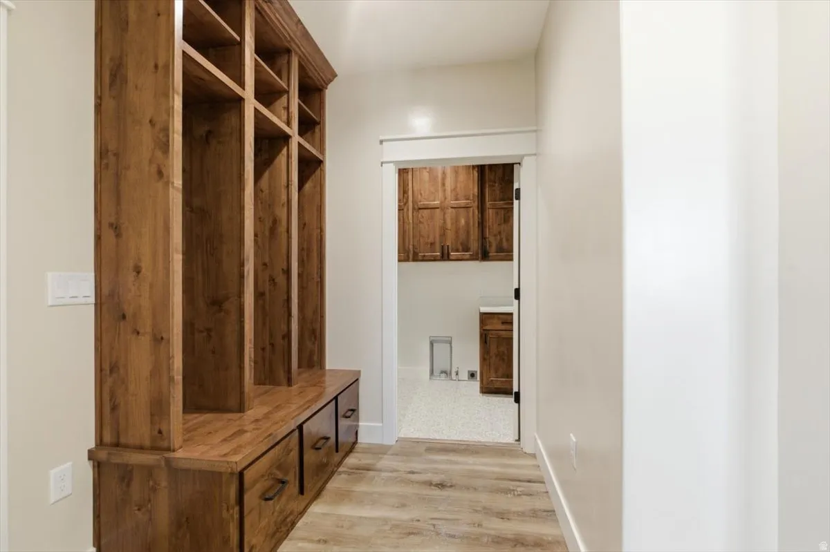 Mudroom with light wood finished floors