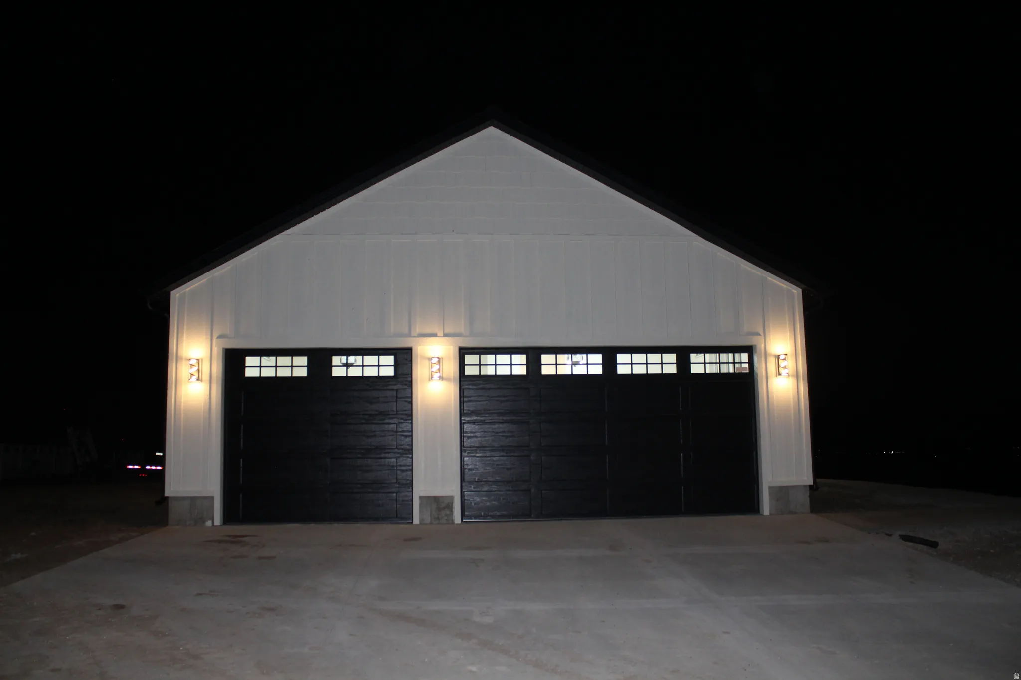 View of garage at twilight