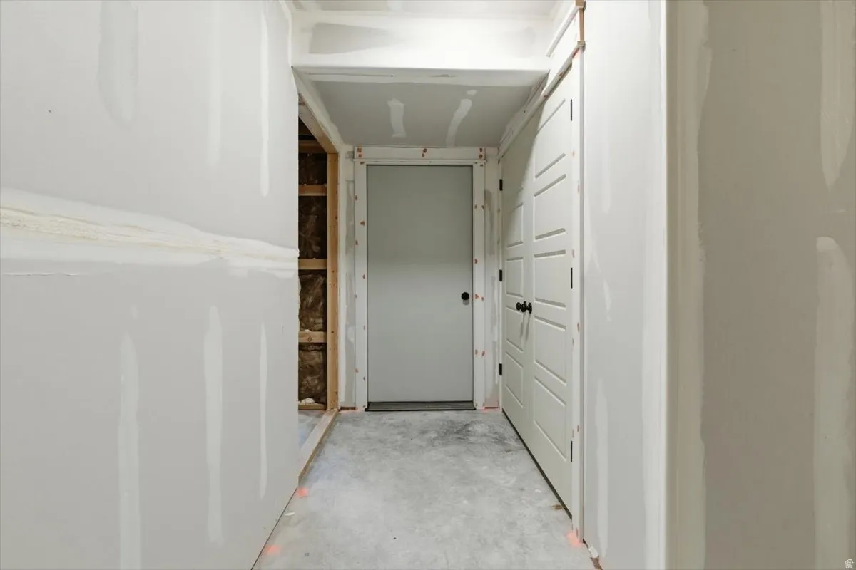 Hall with concrete flooring
