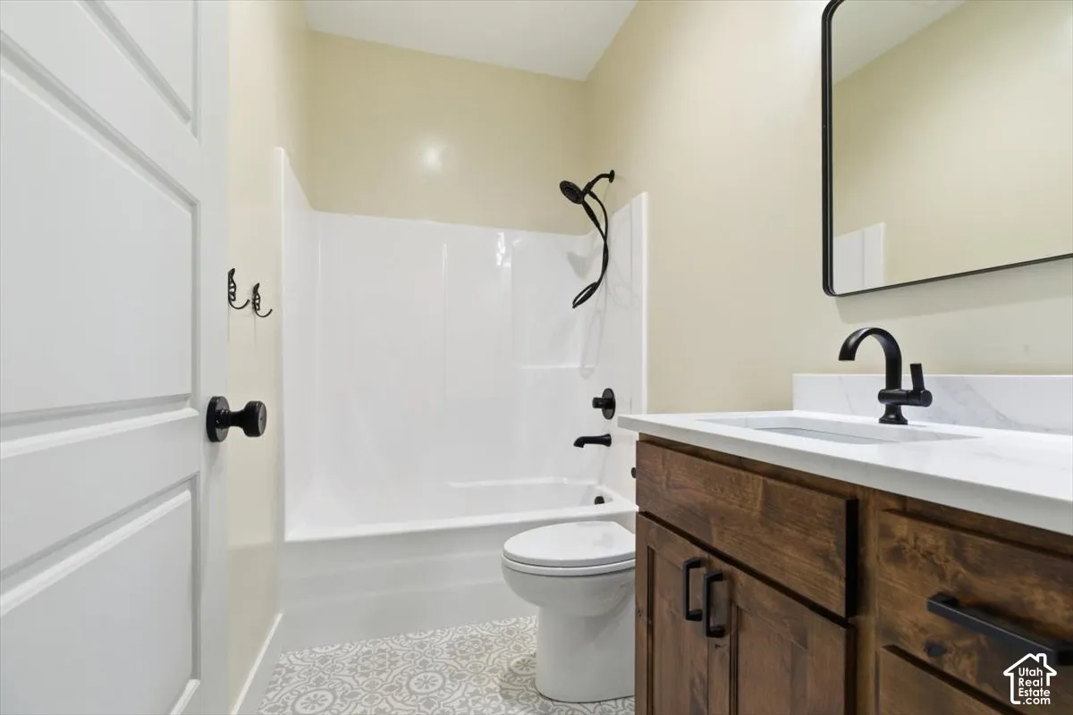 Bathroom featuring vanity and shower / tub combination