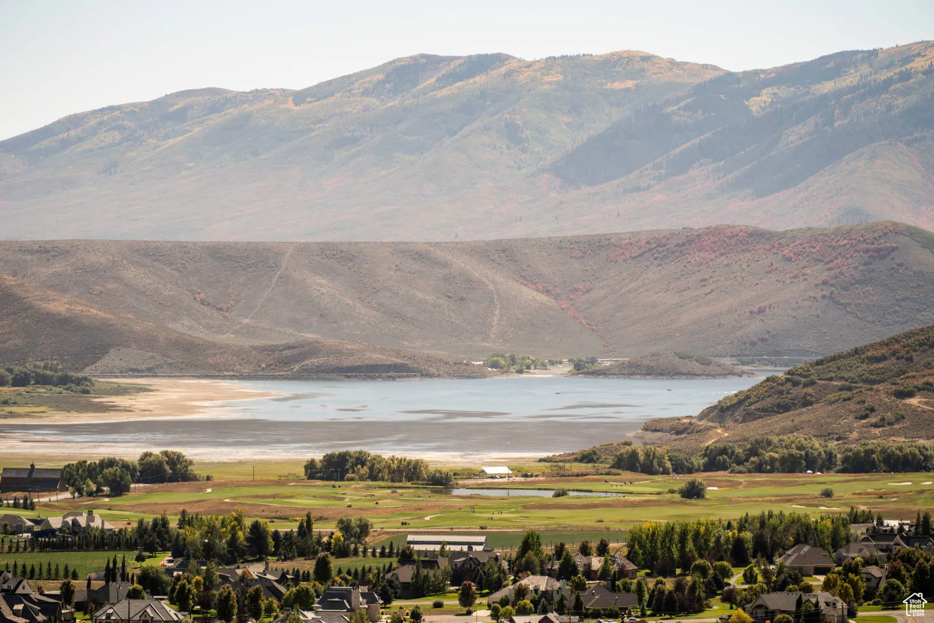 View of mountain background with a large body of water and nearby suburban area